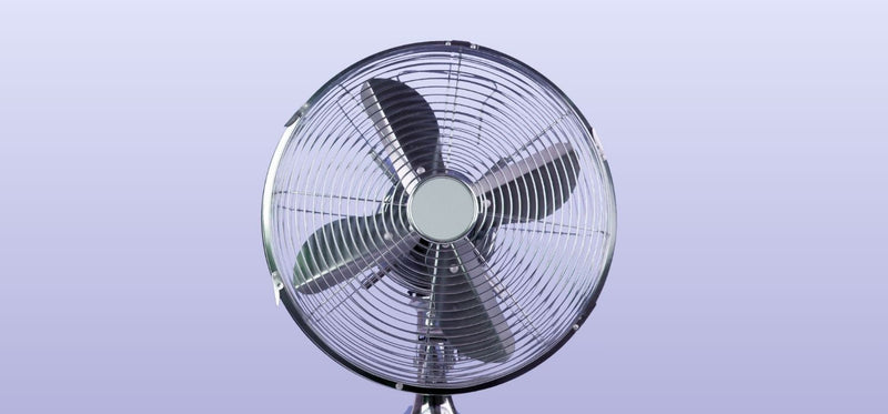 An image of a silver metal fan on a purple background.