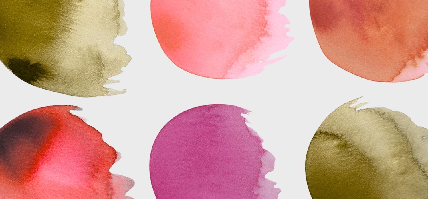 A closeup image of multi-colored watercolor swatches.