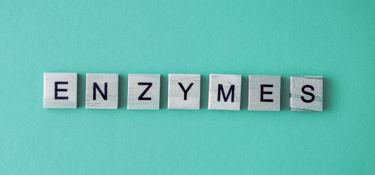 The word "ENZYMES" spelled out using light grey, square letter tiles on a solid teal background.