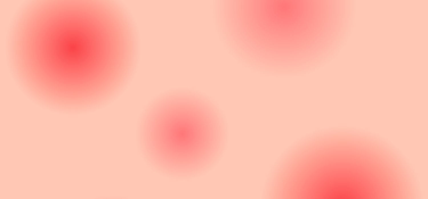 An image of red gradient dots on a pinkish-beige background.