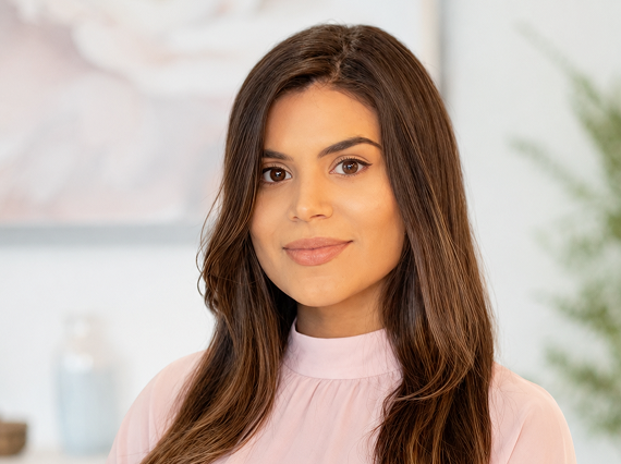 Woman in a light pink top