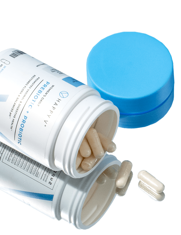 Happy V Prebiotic + Probiotic supplement bottle with capsules spilling out, showcasing health-focused product.