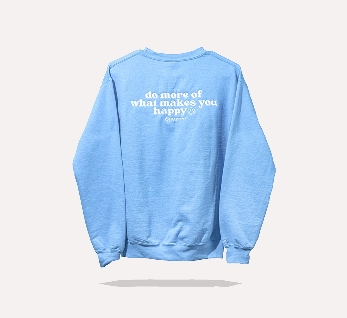 Blue sweatshirt featuring "do more of what makes you happy" text, embodying Happy V's wellness ethos.