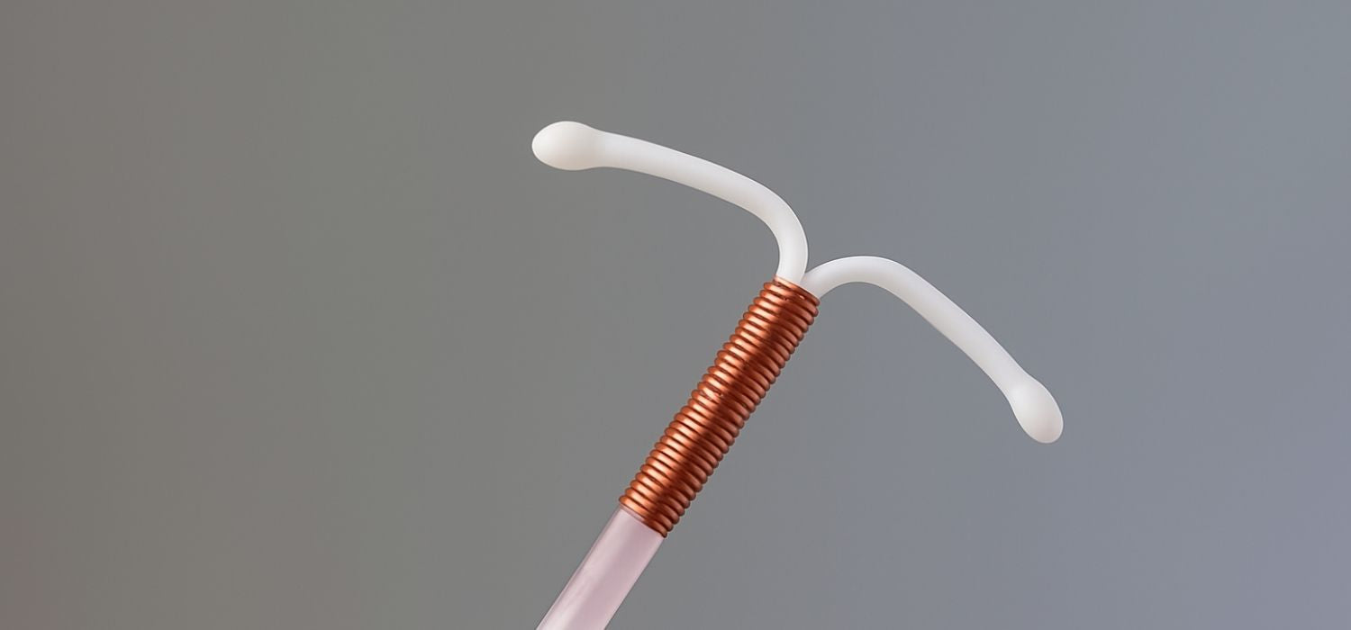 A high-resolution photograph of a copper IUD.