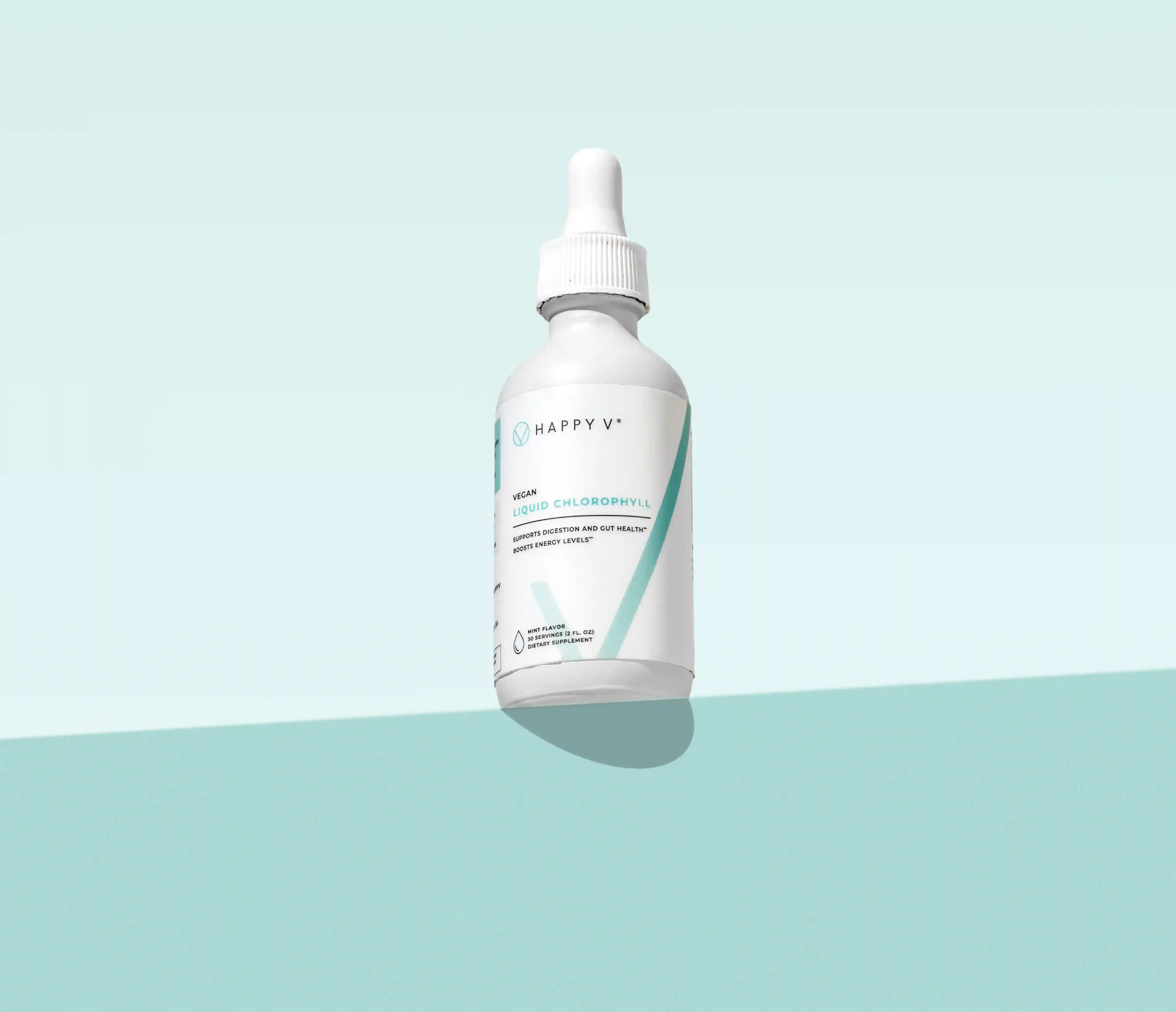 Happy V supplement dropper bottle on a light blue background, emphasizing feminine wellness.