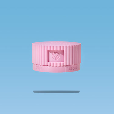 Pink pill organizer with Happy V logo on a blue background, emphasizing feminine wellness.