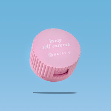 Pink Happy V cap with "In my self-care era" text, promoting feminine wellness.