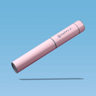 Pink Happy V bottle on blue background, highlighting feminine wellness.