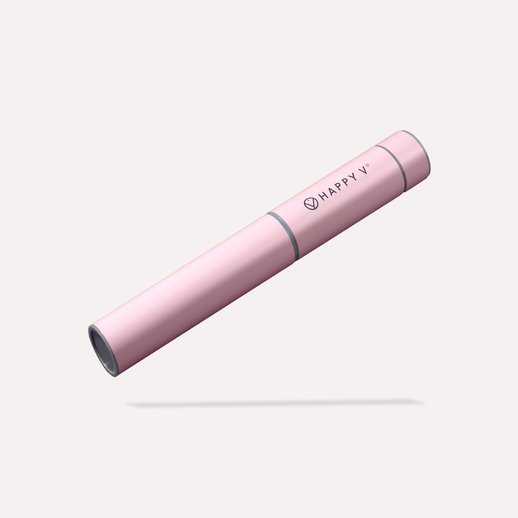 Pink Happy V electric whisk with clean design on a soft, light background.