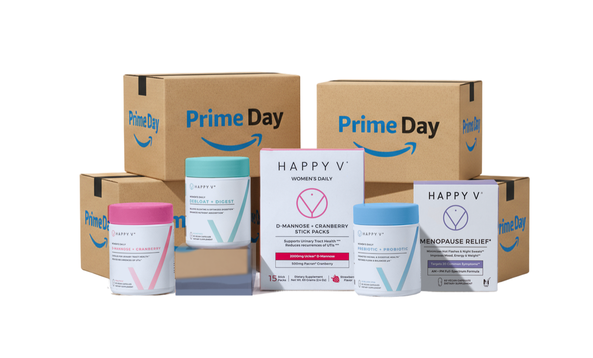 Happy V supplements displayed in front of Amazon Prime Day boxes, promoting women's wellness products.
