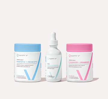 Happy V supplements trio: prebiotic, chlorophyll, and D-mannose bottles on a clean surface.
