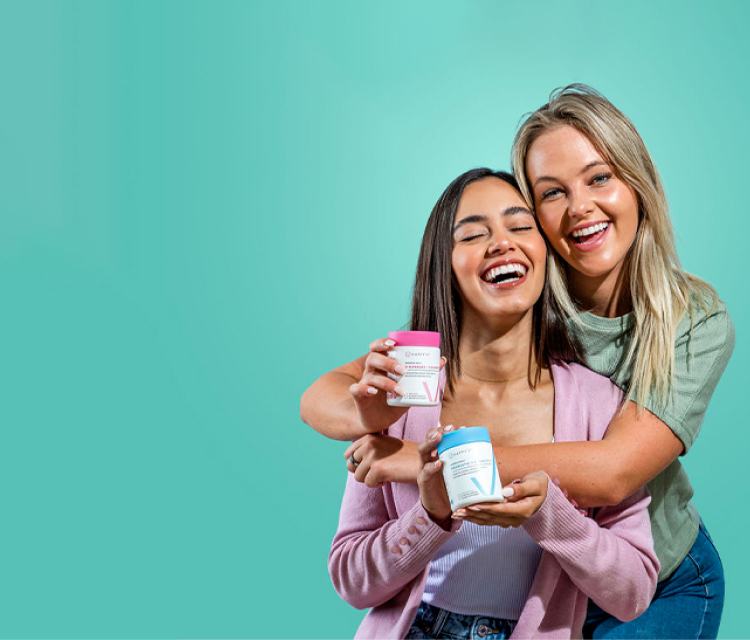 Two girls holding Happy V supplements