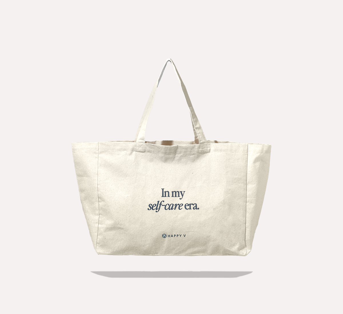 Canvas tote with "In my self-care era" text, promoting Happy V's wellness focus.