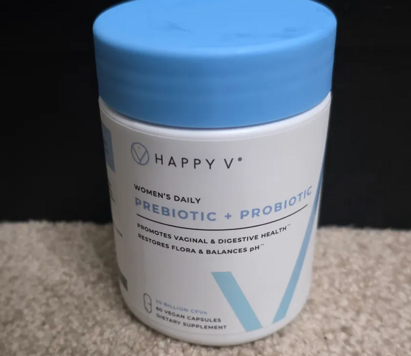 Happy V Women's Daily Prebiotic + Probiotic dietary supplement in a blue and white container.